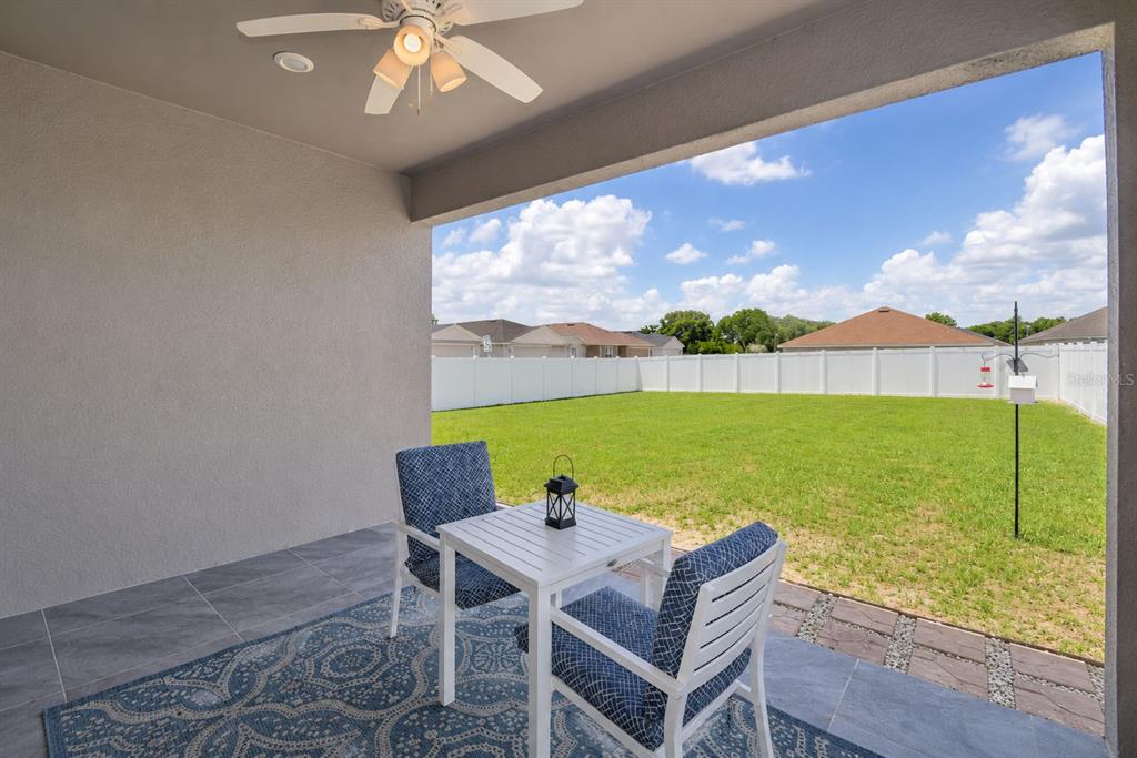 4340 Reding Way Lakeland, FL 33813 - Photo 54 of 63 a view of an chairs and table in the patio
