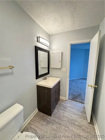 a view of room with wooden floor