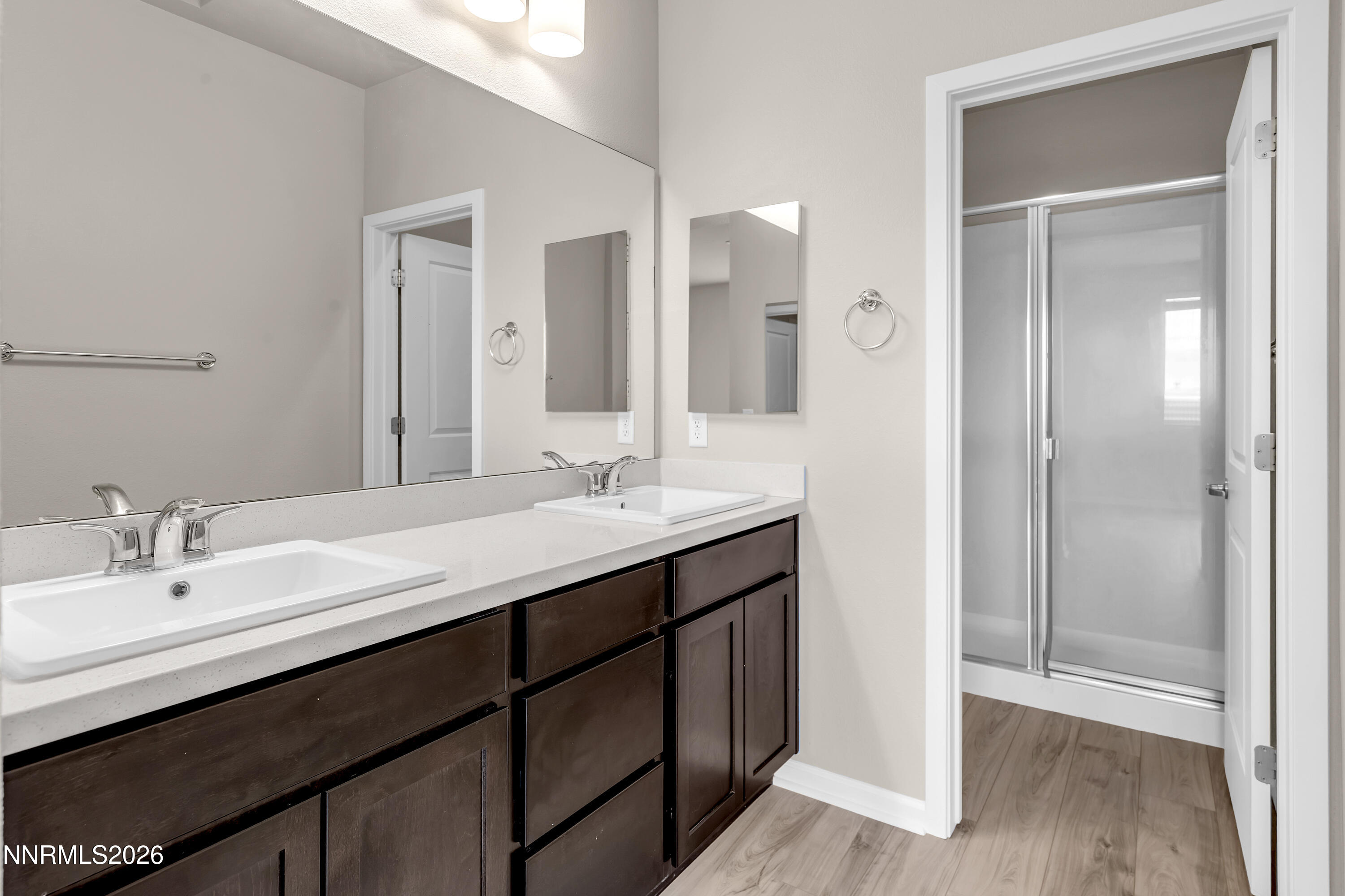 2150 Altamira Drive Reno, NV 89523 - Photo 12 of 21 a bathroom with a double vanity sink mirror and shower