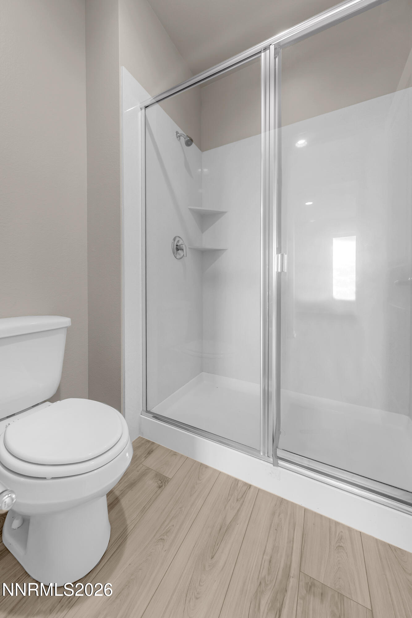 2150 Altamira Drive Reno, NV 89523 - Photo 14 of 21 a white toilet sitting next to a bathroom sink