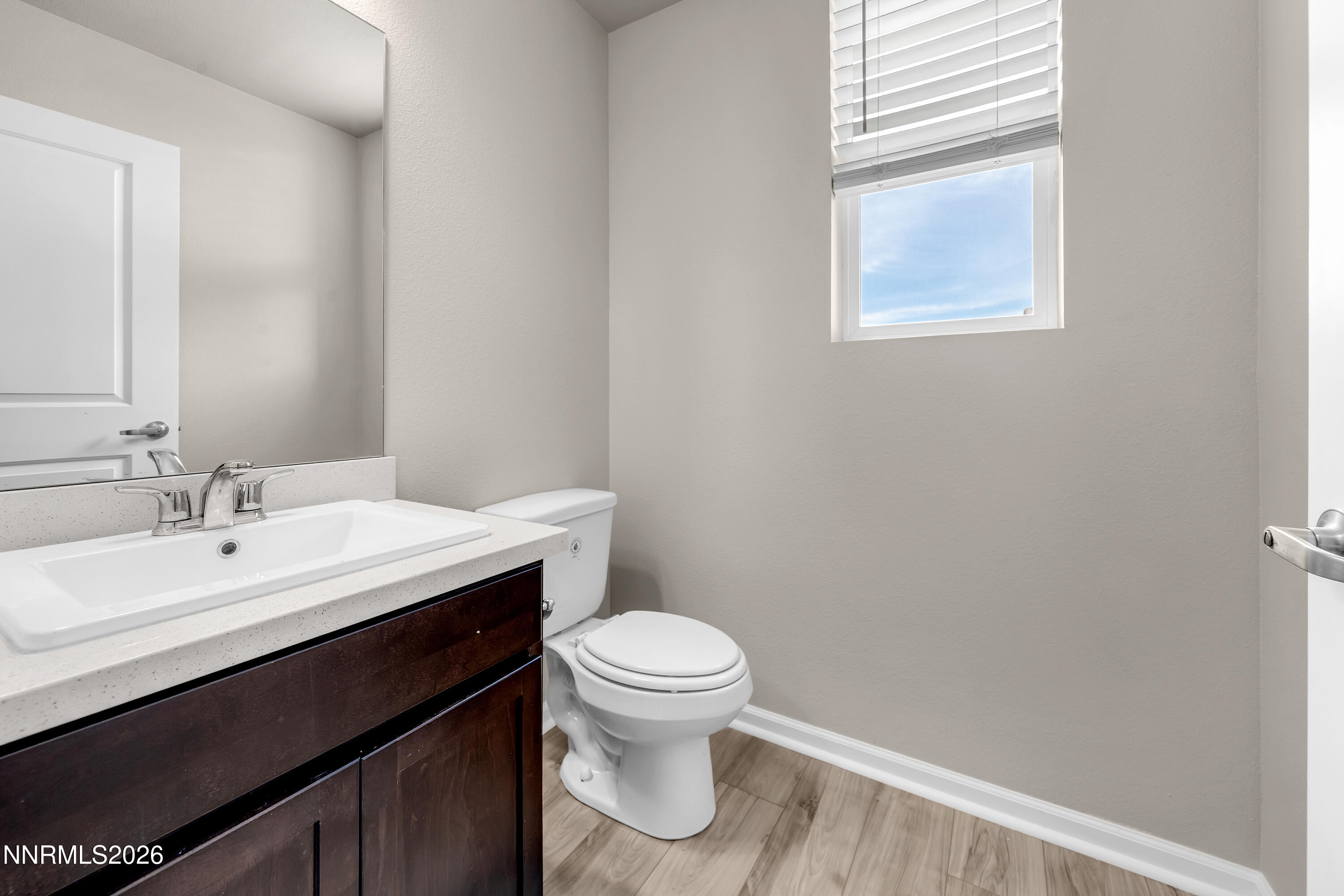 2150 Altamira Drive Reno, NV 89523 - Photo 20 of 21 a bathroom with a sink a toilet and a window