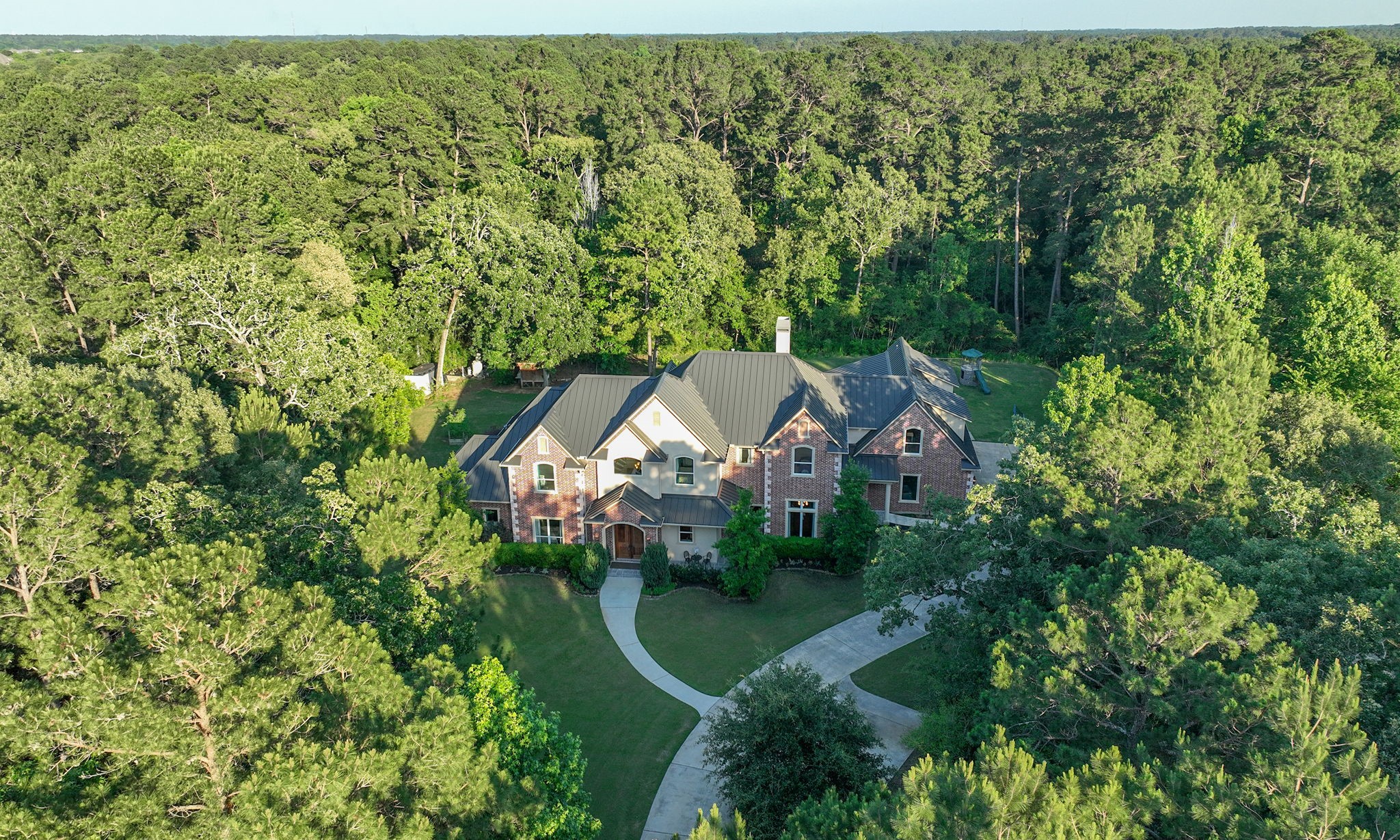36702 Deer Valley Magnolia, TX 77355 - Photo 40 of 46 an aerial view of a house with yard and green space