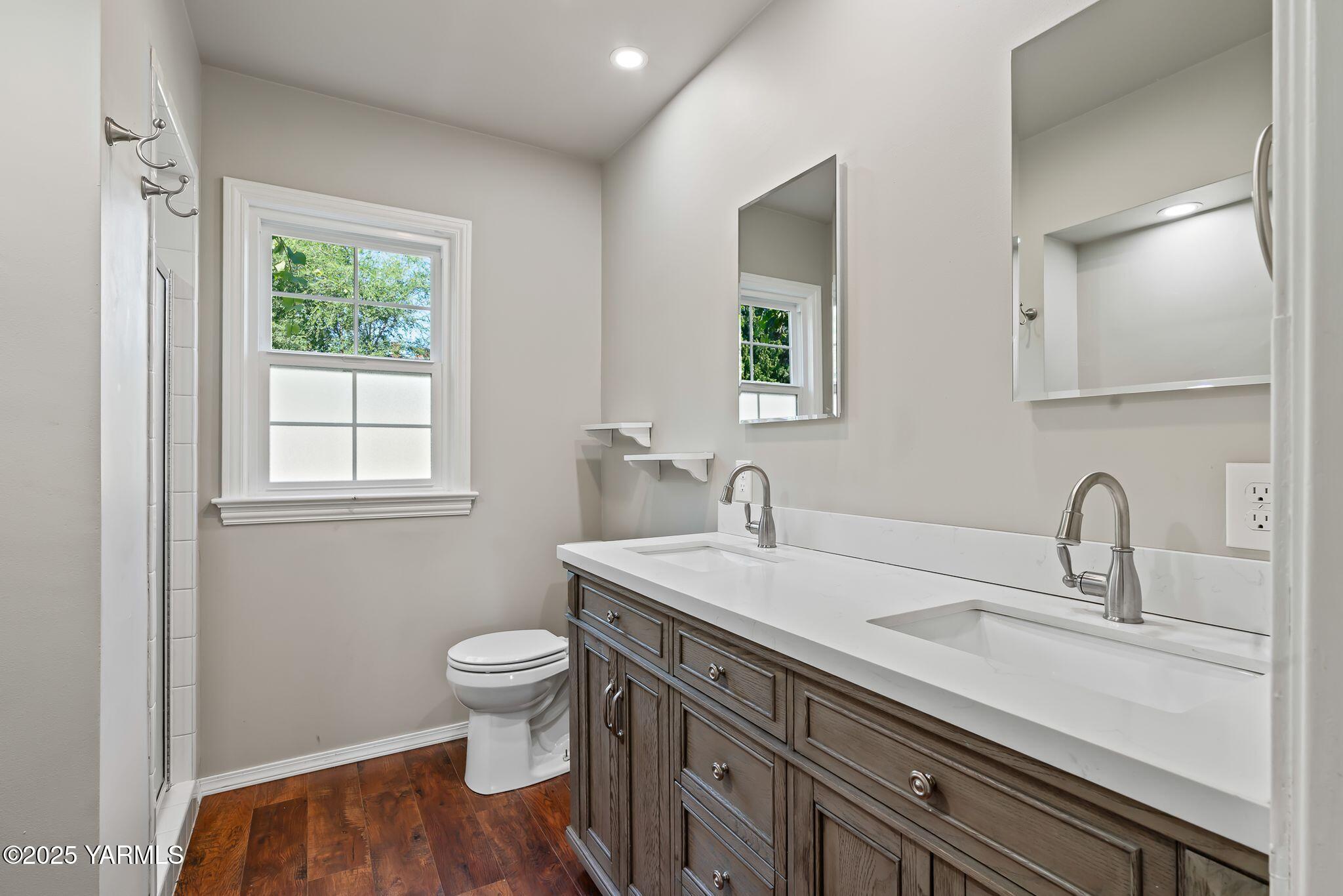 3310 Summitview Avenue Yakima, WA 98902 - Photo 14 of 39 a bathroom with a sink a toilet and a mirror