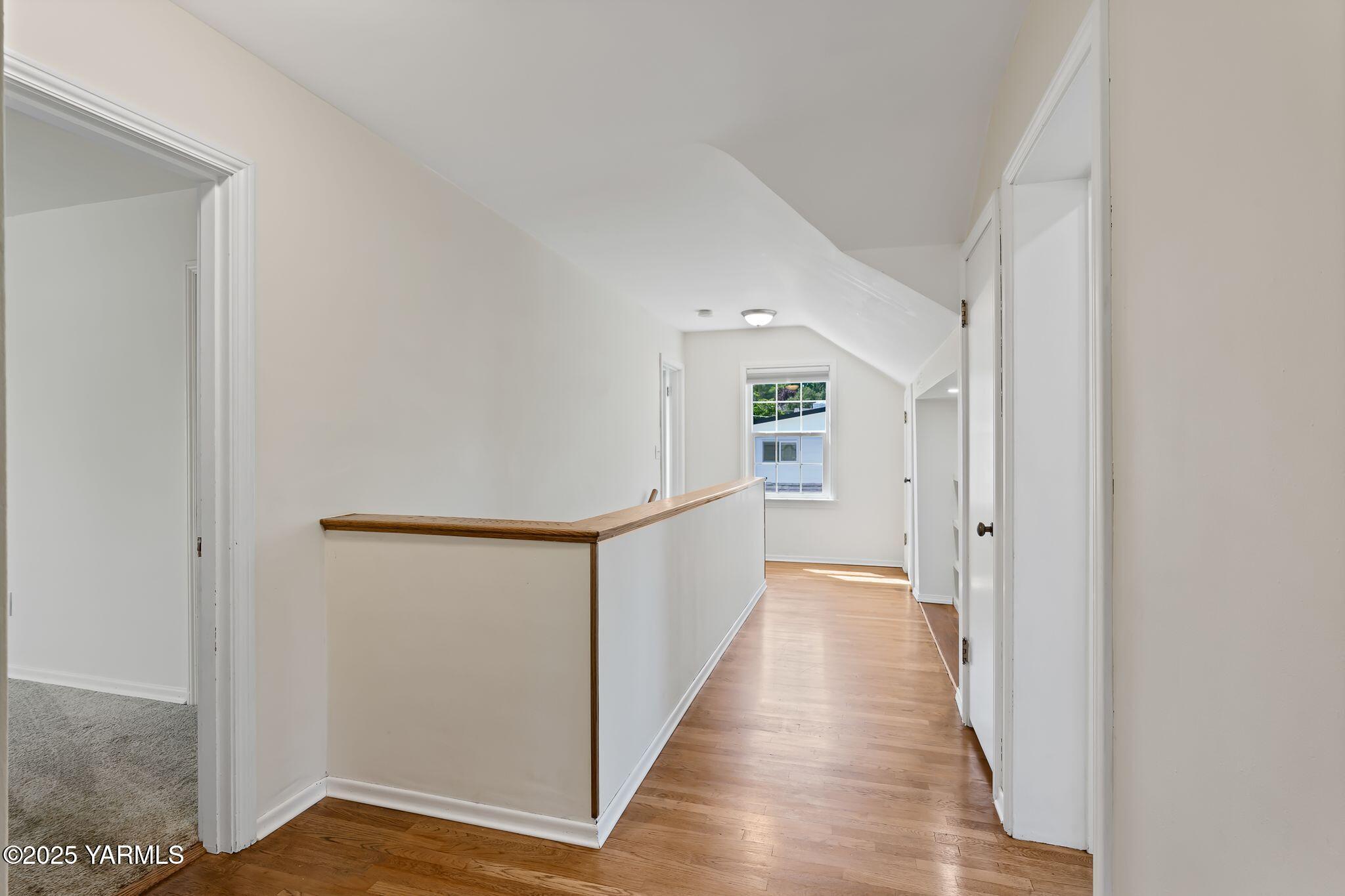 3310 Summitview Avenue Yakima, WA 98902 - Photo 17 of 39 a view of a hallway with wooden floor