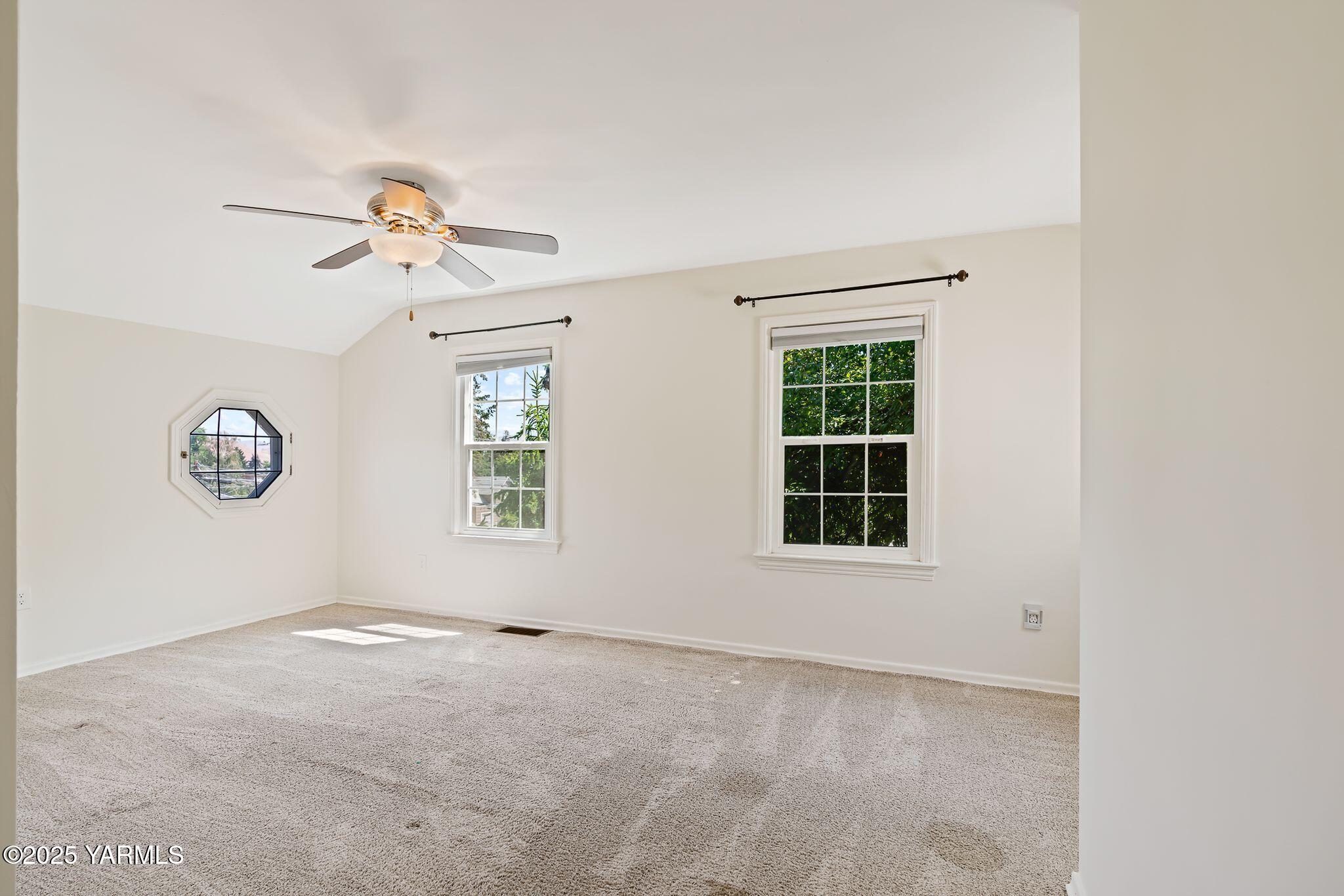 3310 Summitview Avenue Yakima, WA 98902 - Photo 19 of 39 an empty room with windows and fan