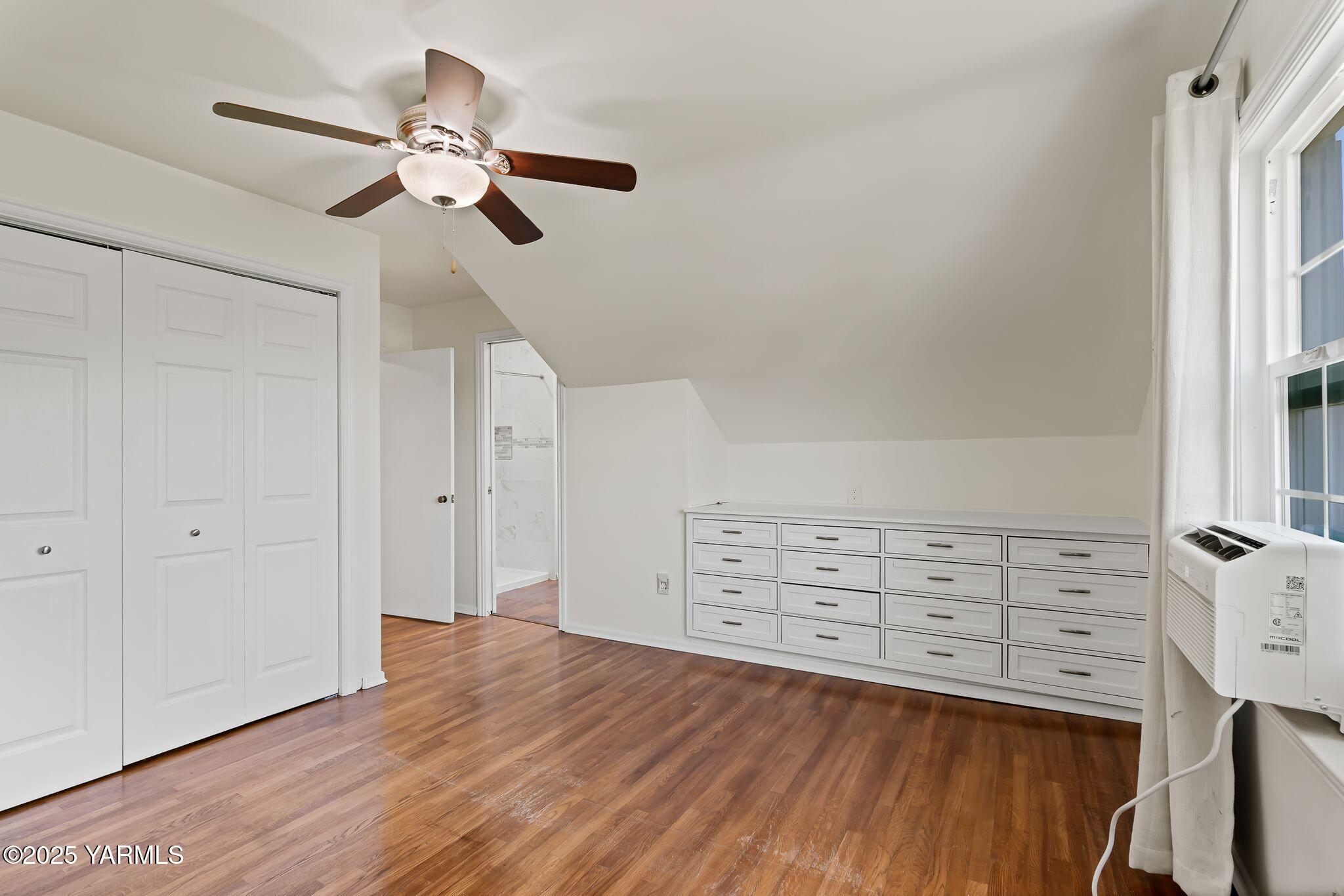 3310 Summitview Avenue Yakima, WA 98902 - Photo 23 of 39 a view of a bedroom with wooden floor and closet