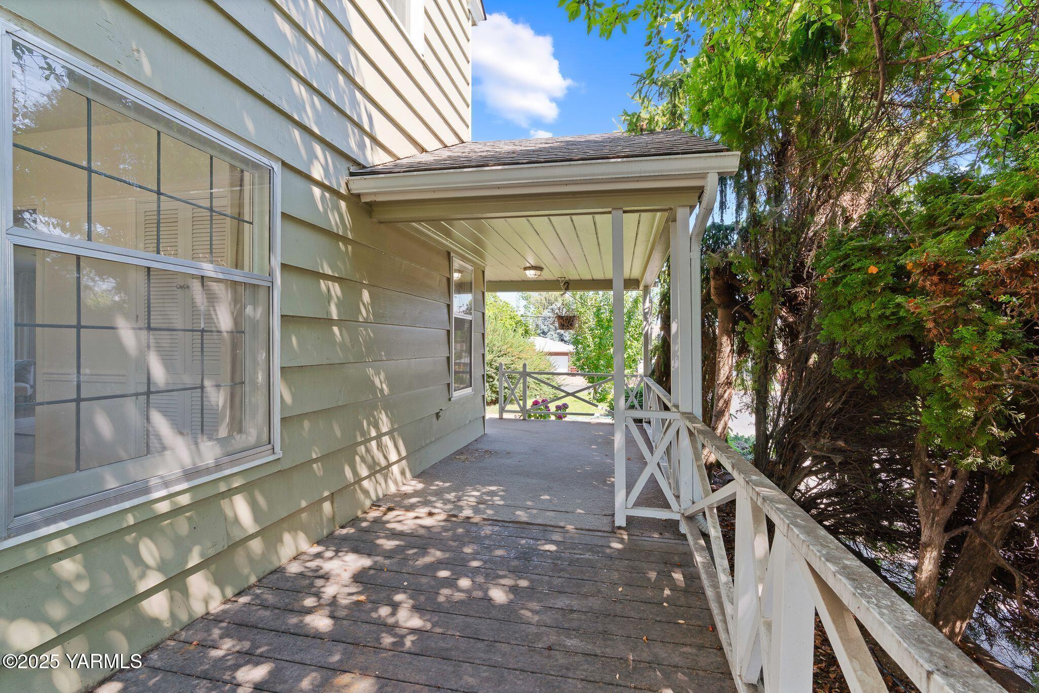3310 Summitview Avenue Yakima, WA 98902 - Photo 31 of 39 a view of backyard with wooden fence and large trees