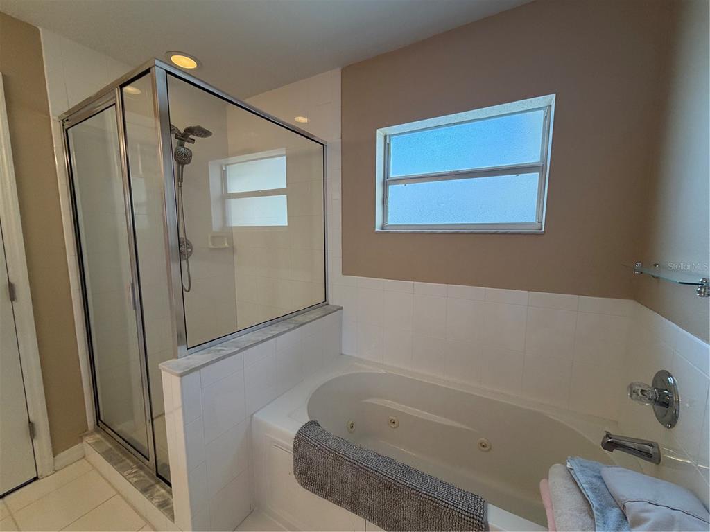2723 West Arch Street Tampa, FL 33607 - Photo 14 of 14 a bathroom with a bathtub and a shower