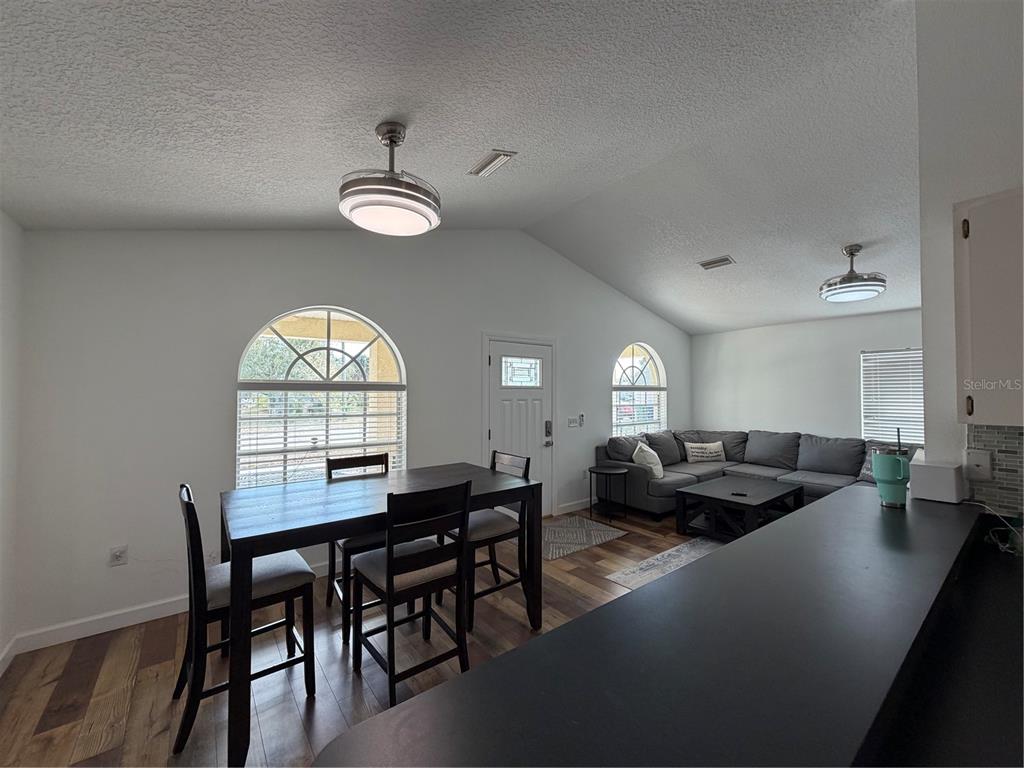 2723 West Arch Street Tampa, FL 33607 - Photo 6 of 14 a view of a dining room with furniture and a large window