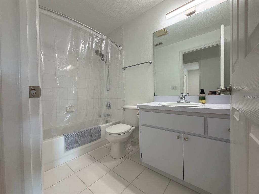 2723 West Arch Street Tampa, FL 33607 - Photo 9 of 14 a bathroom with a sink toilet and shower