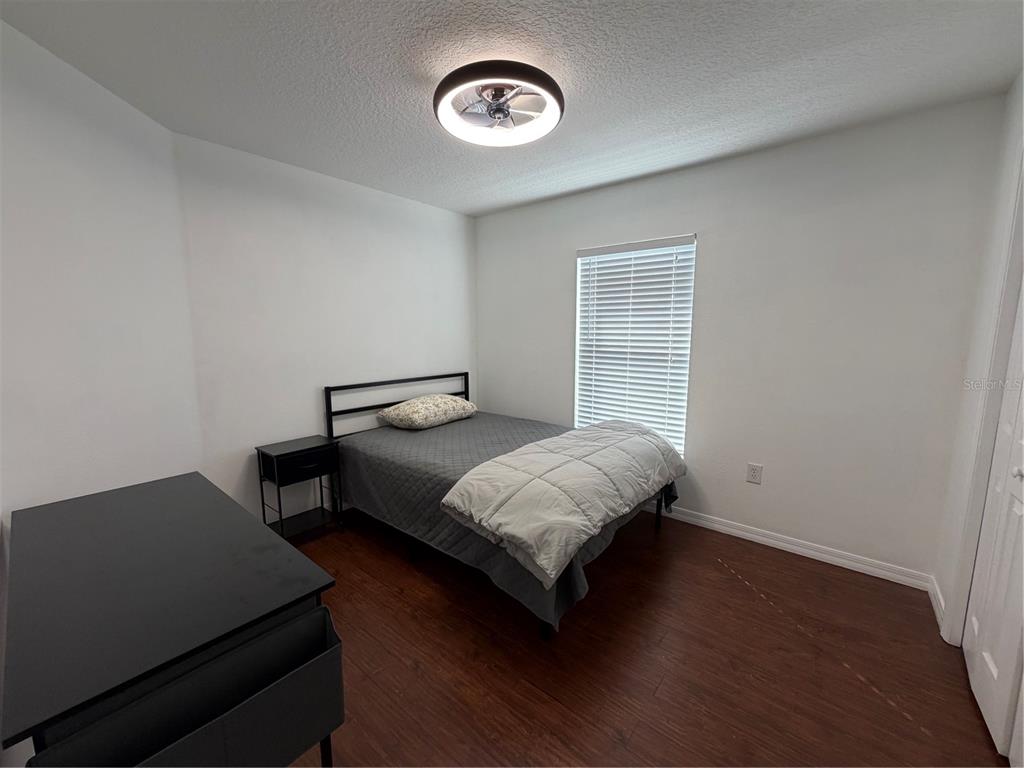 2723 West Arch Street Tampa, FL 33607 - Photo 10 of 14 a bedroom with a bed and a window