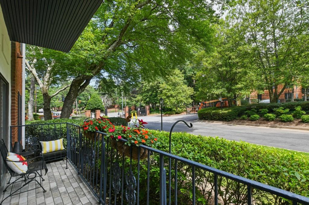 2921 Lenox Road Northeast, Unit 103 Atlanta, GA 30324 - Photo 30 of 37 a view of a chairs and table in the balcony