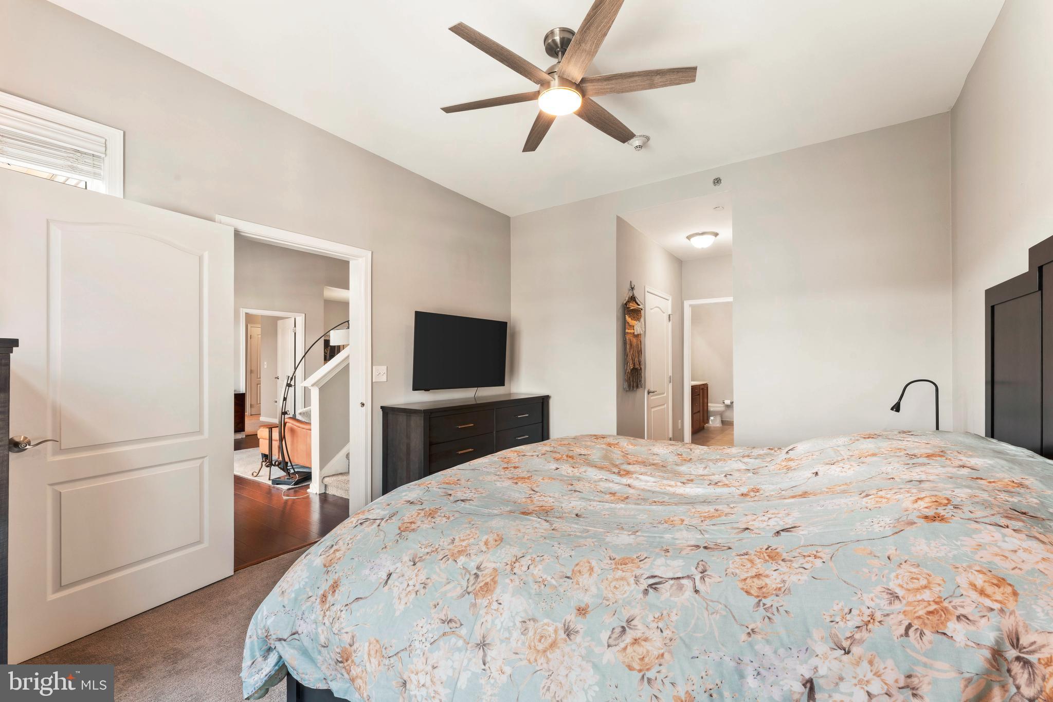 531 Carson Terrace Huntingdon Valley, PA 19006 - Photo 24 of 46 a large bedroom with a bed and a flat screen tv