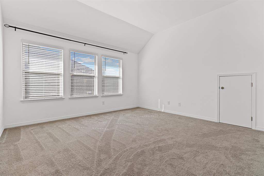 20520 Carries Ranch Road Pflugerville, TX 78660 - Photo 16 of 26 Unfurnished room with light carpet and lofted ceiling