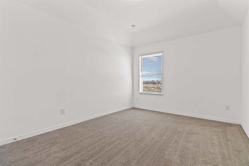 20520 Carries Ranch Road Pflugerville, TX 78660 - Photo 20 of 26 Carpeted empty room with baseboards