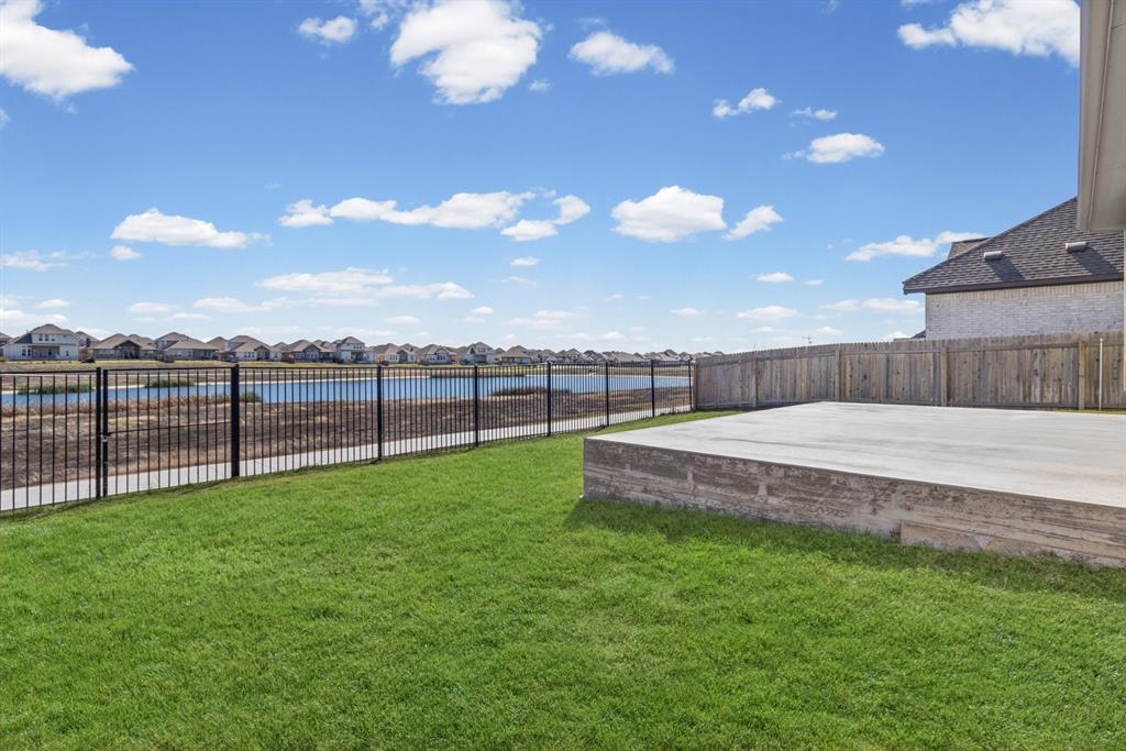 20520 Carries Ranch Road Pflugerville, TX 78660 - Photo 26 of 26 Fenced yard featuring a residential view, a patio, and a water view