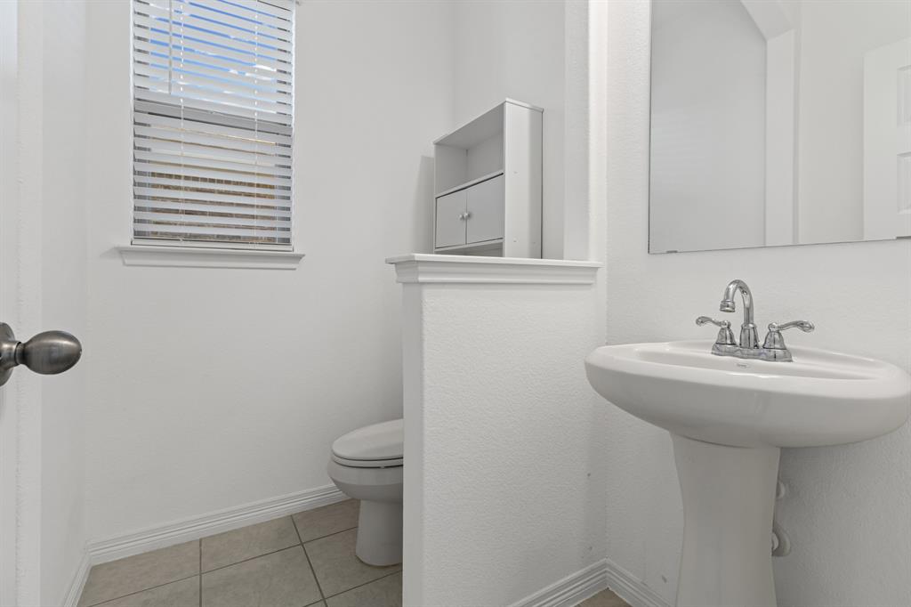 20520 Carries Ranch Road Pflugerville, TX 78660 - Photo 9 of 26 Bathroom featuring baseboards and light tile patterned floors