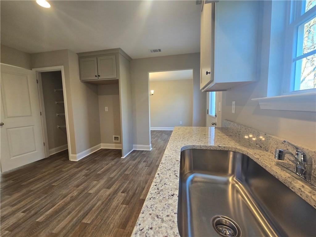 2978 Cannon Bridge Road Demorest, GA 30535 - Photo 13 of 36 a room with a hallway and wooden floor