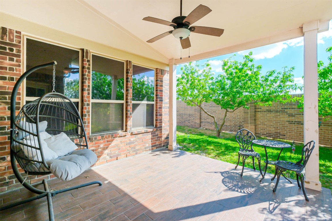 4718 Sedgewood Drive Rosenberg, TX 77471 - Photo 20 of 23 a view of a porch with furniture and garden
