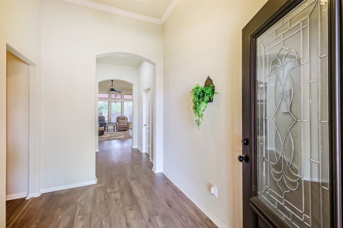 4718 Sedgewood Drive Rosenberg, TX 77471 - Photo 2 of 23 a view of a hallway with wooden floor and a livingroom