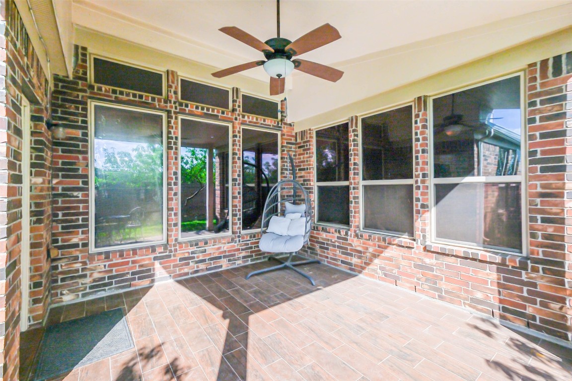 4718 Sedgewood Drive Rosenberg, TX 77471 - Photo 21 of 23 a view of a patio with a table and chairs