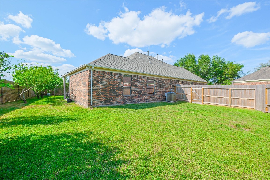 4718 Sedgewood Drive Rosenberg, TX 77471 - Photo 22 of 23 a view of a house with a yard