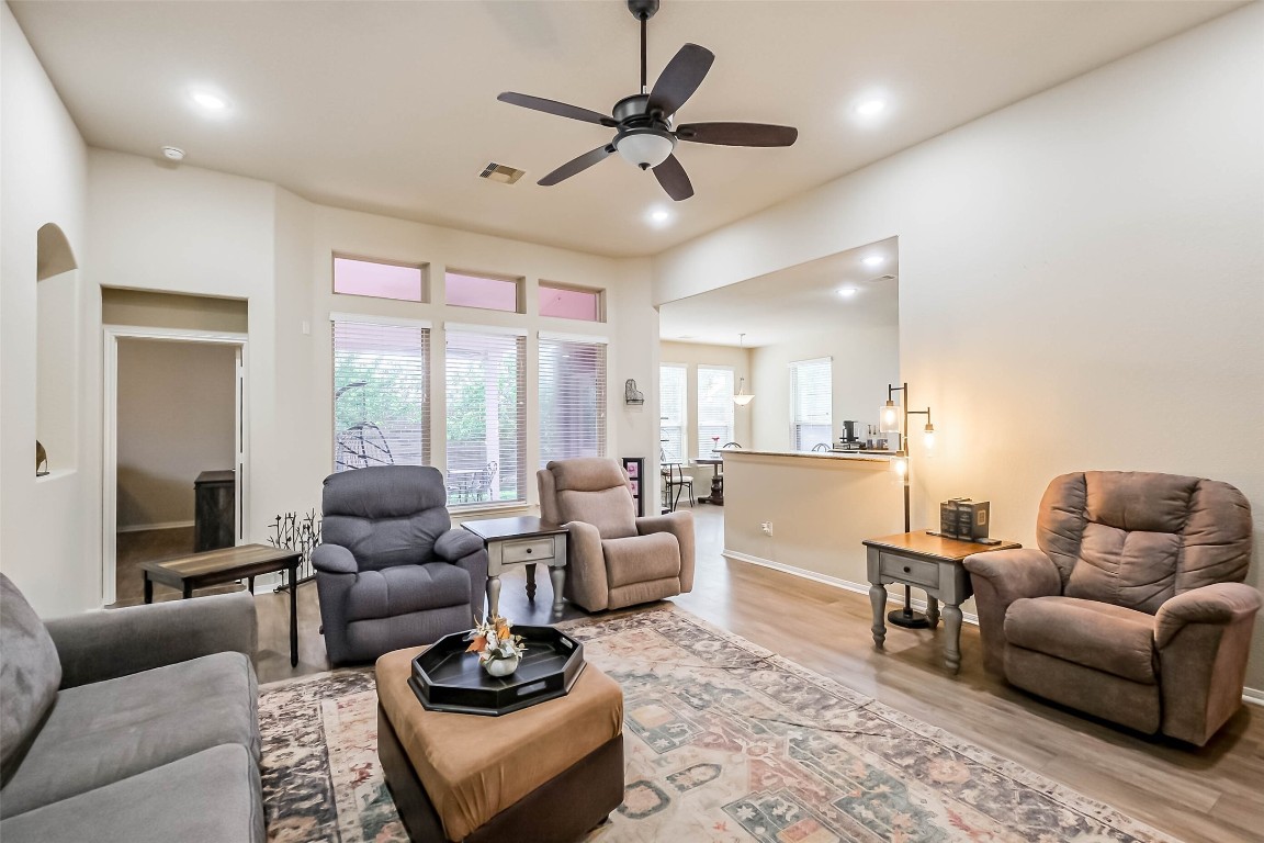 4718 Sedgewood Drive Rosenberg, TX 77471 - Photo 3 of 23 a living room with furniture ceiling fan and a rug