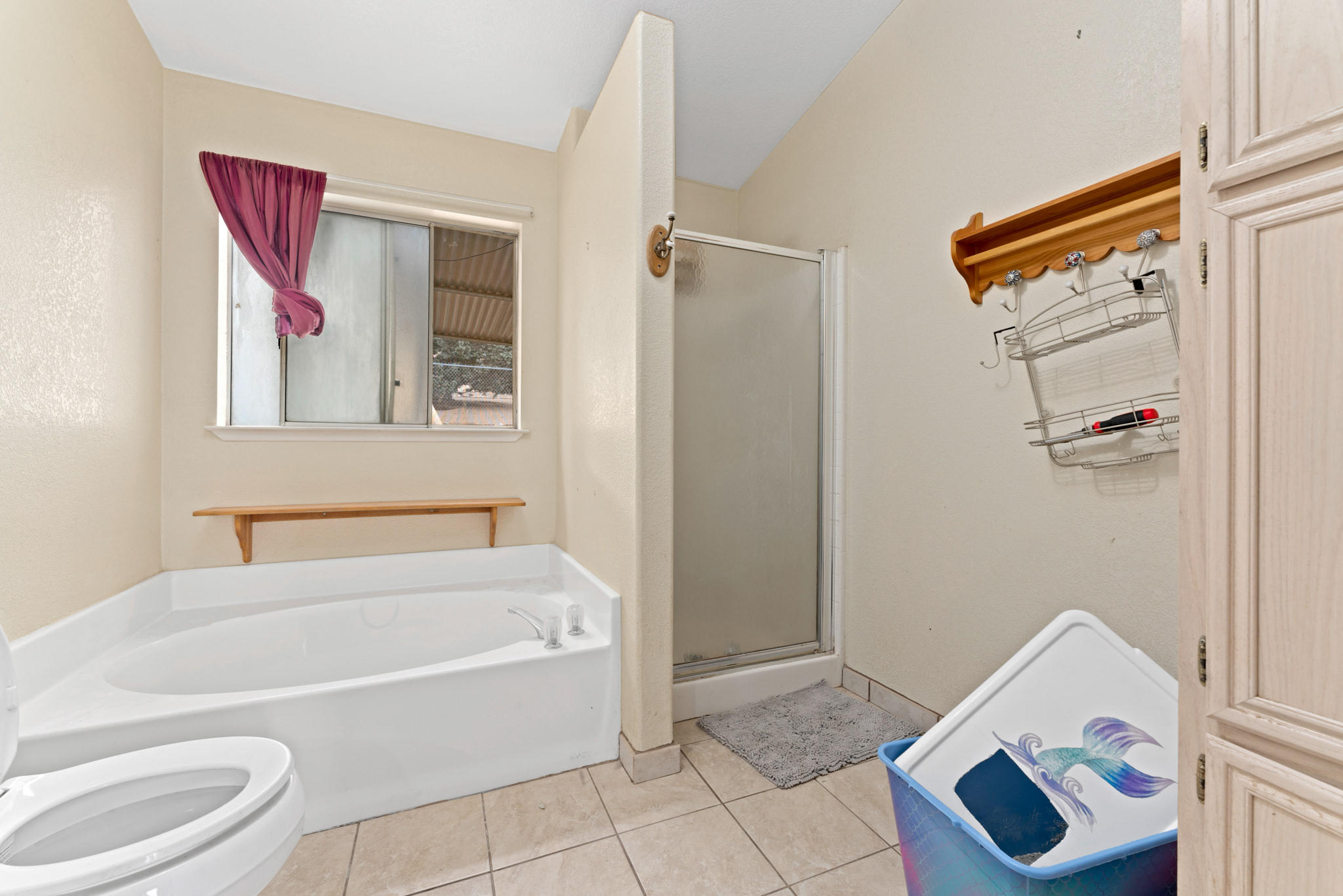 32035 Mountain Shadow Road Acton, CA 93510 - Photo 25 of 34 a bathroom with a bathtub and shower