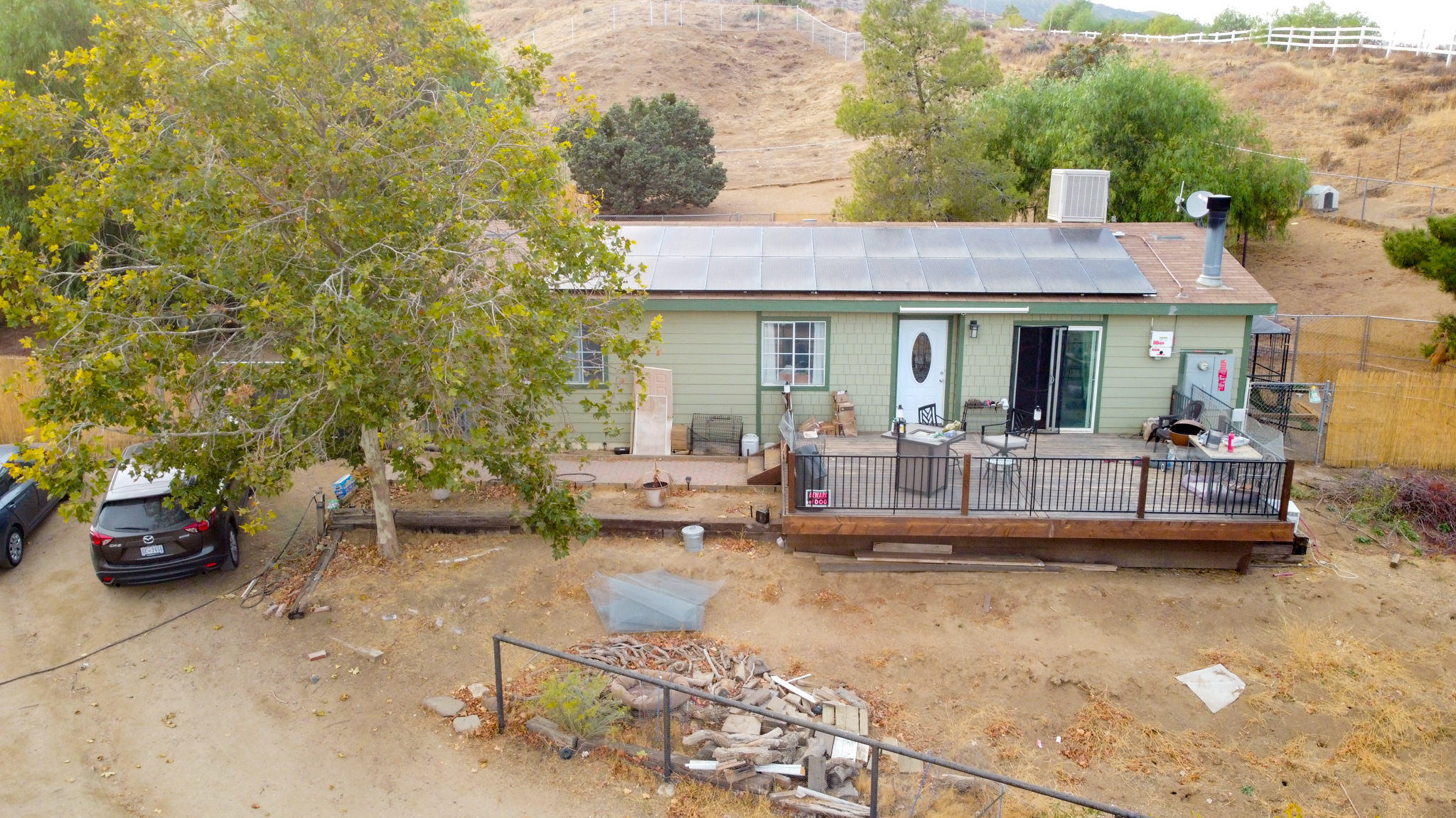 32035 Mountain Shadow Road Acton, CA 93510 - Photo 6 of 34 a view of a patio with couches table and chairs and potted plants