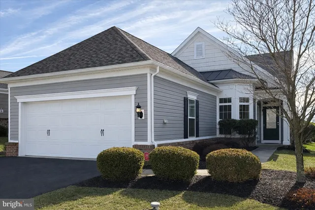 a view of a porch with furniture and a tree
