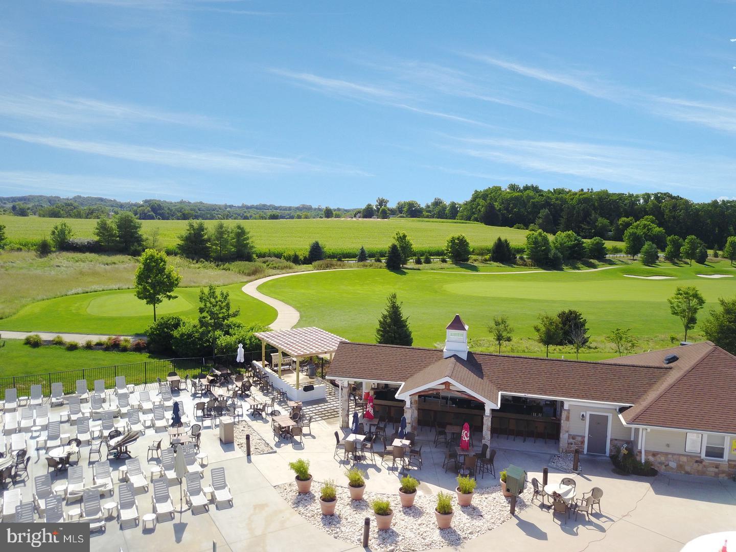580 Prizer Court Downingtown, PA 19335 - Photo 21 of 28 a view of a lake with a yard and outdoor seating