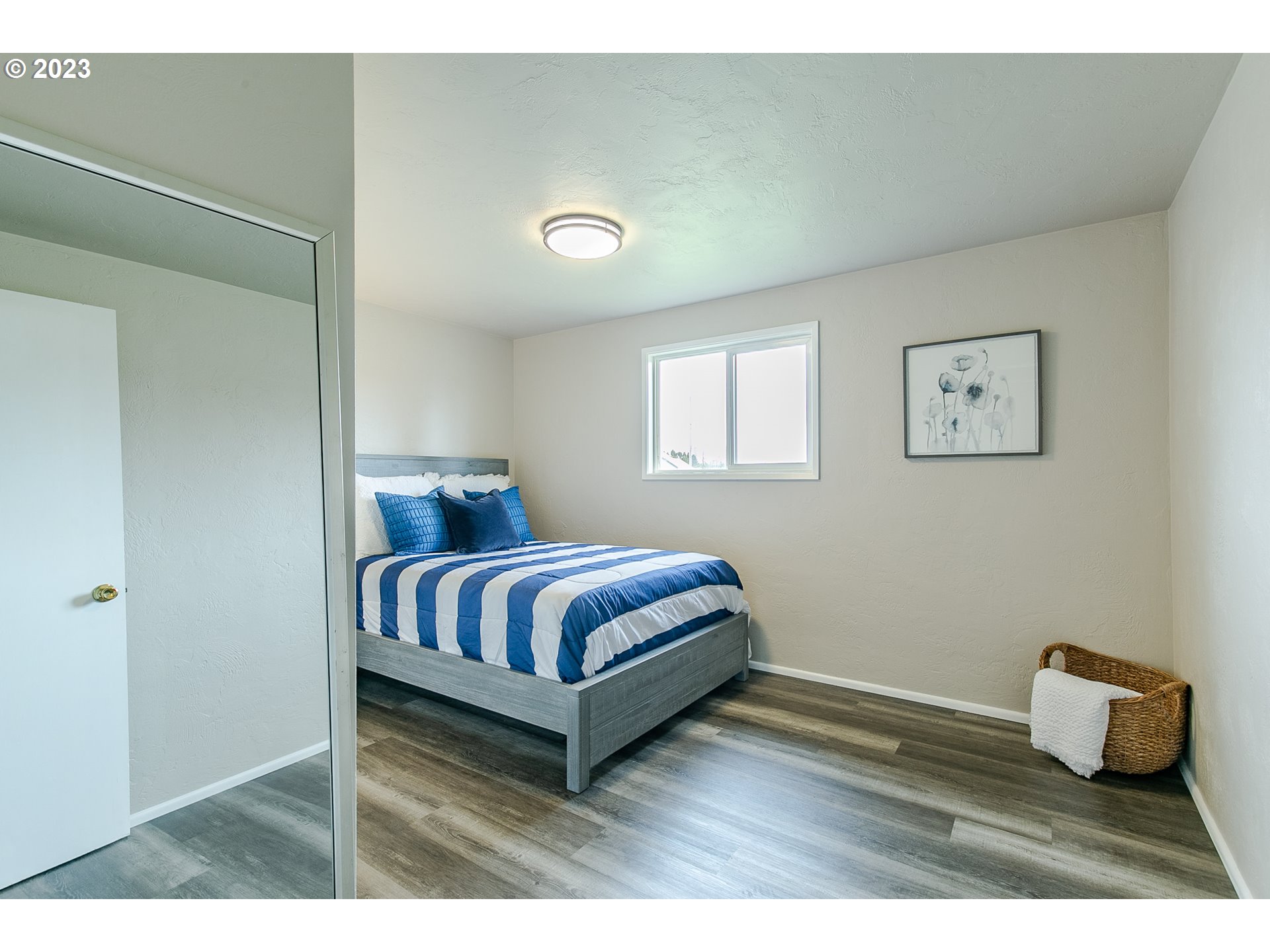594 39th Street Springfield, OR 97478 - Photo 12 of 18 a bedroom with a bed and wooden floor