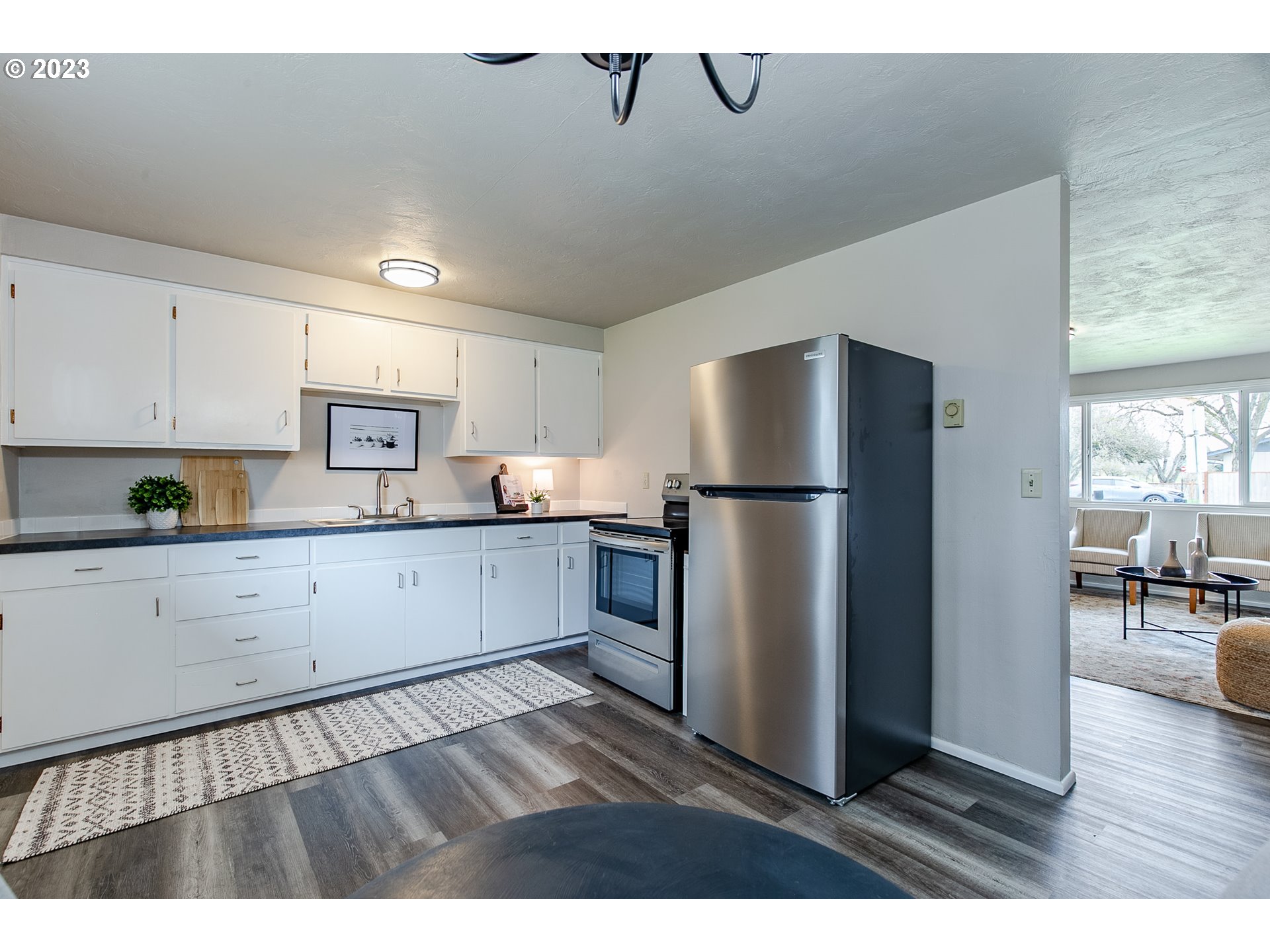 594 39th Street Springfield, OR 97478 - Photo 9 of 18 a kitchen with stainless steel appliances a refrigerator sink and cabinets