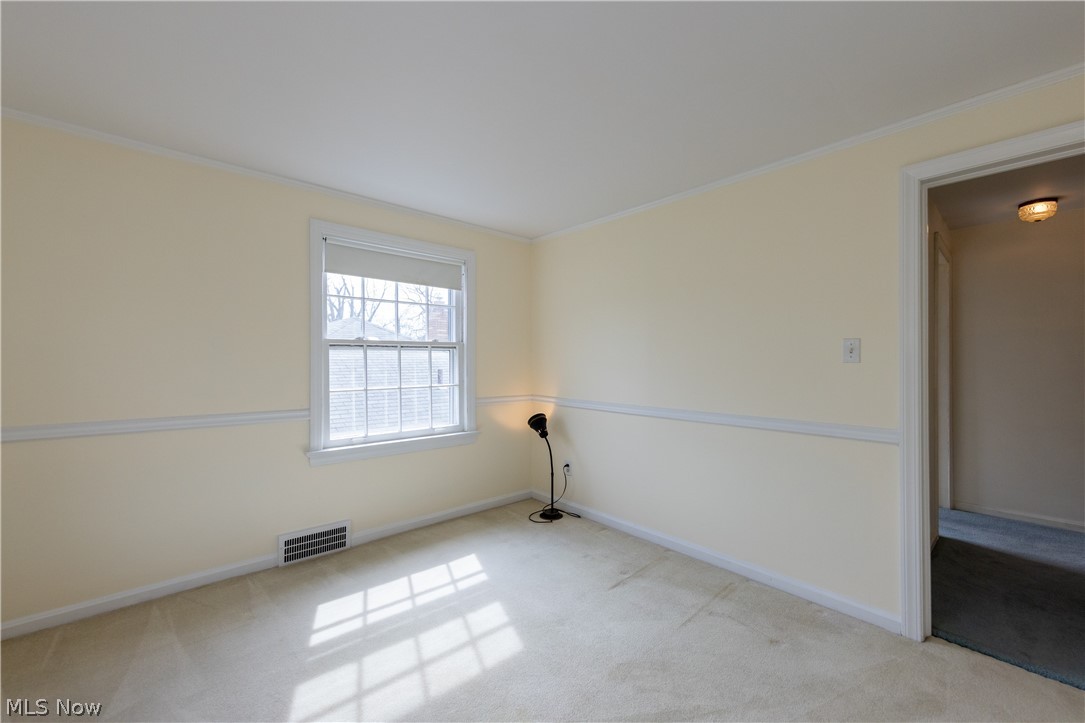 1050 Renfield Road Cleveland Heights, OH 44121 - Photo 19 of 41 Bedroom with light carpet and ornamental molding