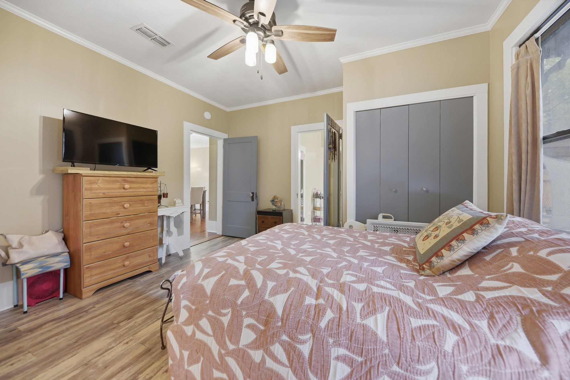 1501 South Austin Street Brenham, TX 77833 - Photo 15 of 36 a bedroom with a bed and a flat screen tv