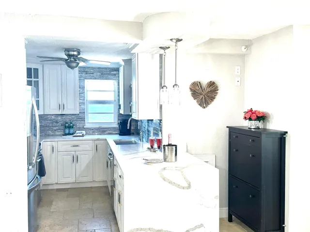a bathroom with a sink vanity and a mirror