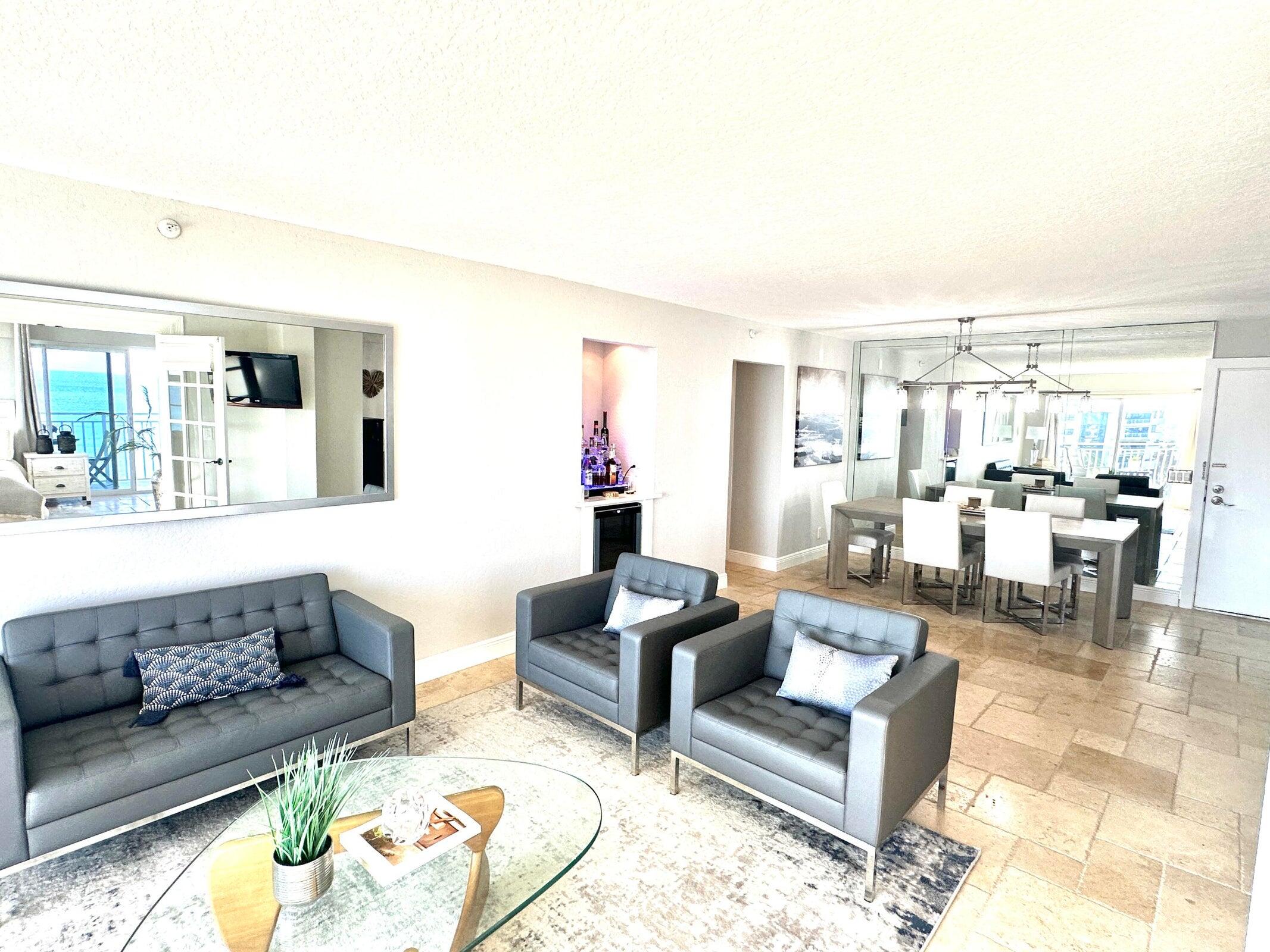 4511 South Ocean Boulevard, Unit 807 Highland Beach, FL 33487 - Photo 7 of 21 a living room with furniture and view of kitchen