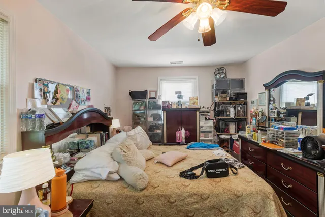 a bedroom with bed and a window