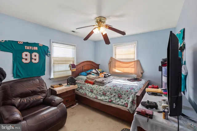 a bathroom with a sink vanity mirror and shower