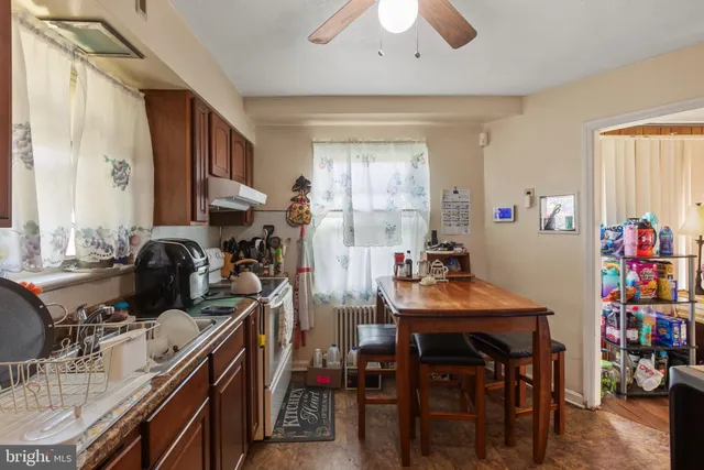 a view of a dining room with furniture and a window