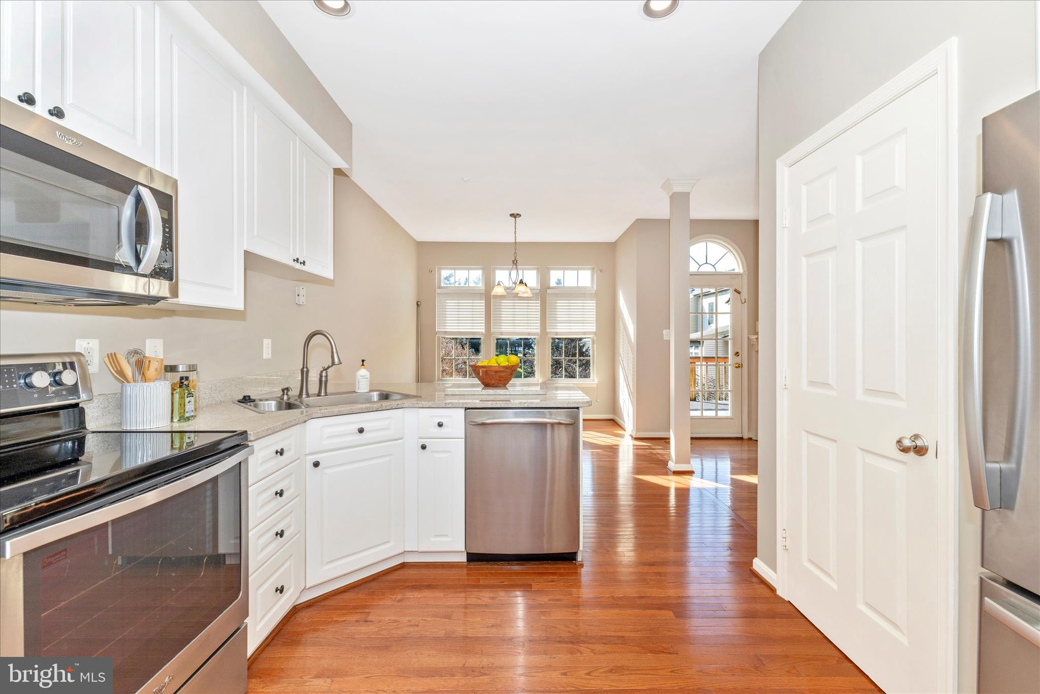 2409 Rippling Brook Road Frederick, MD 21701 - Photo 14 of 69 a kitchen with a sink stove top oven and cabinets