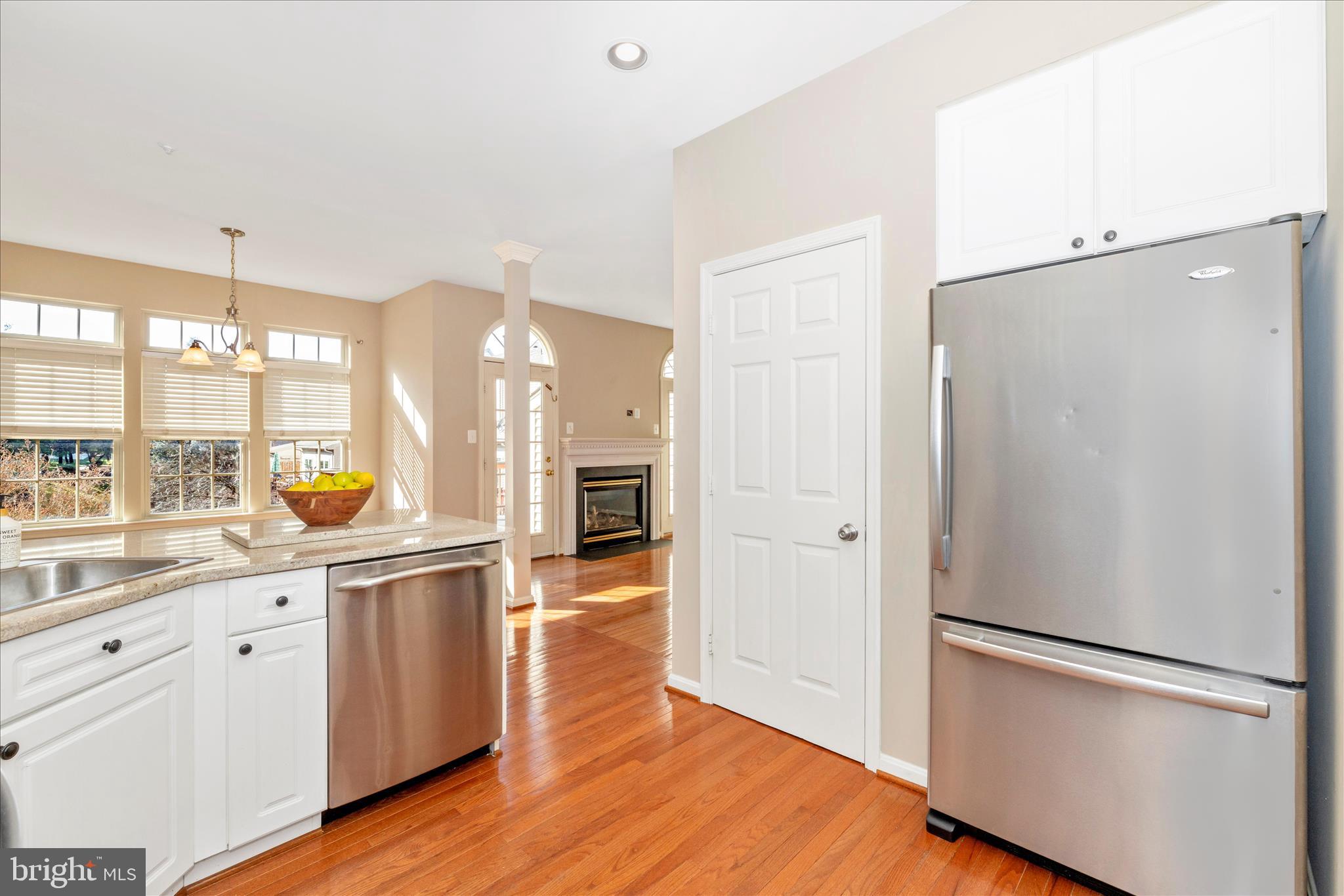 2409 Rippling Brook Road Frederick, MD 21701 - Photo 15 of 69 a kitchen with stainless steel appliances a refrigerator and wooden floor