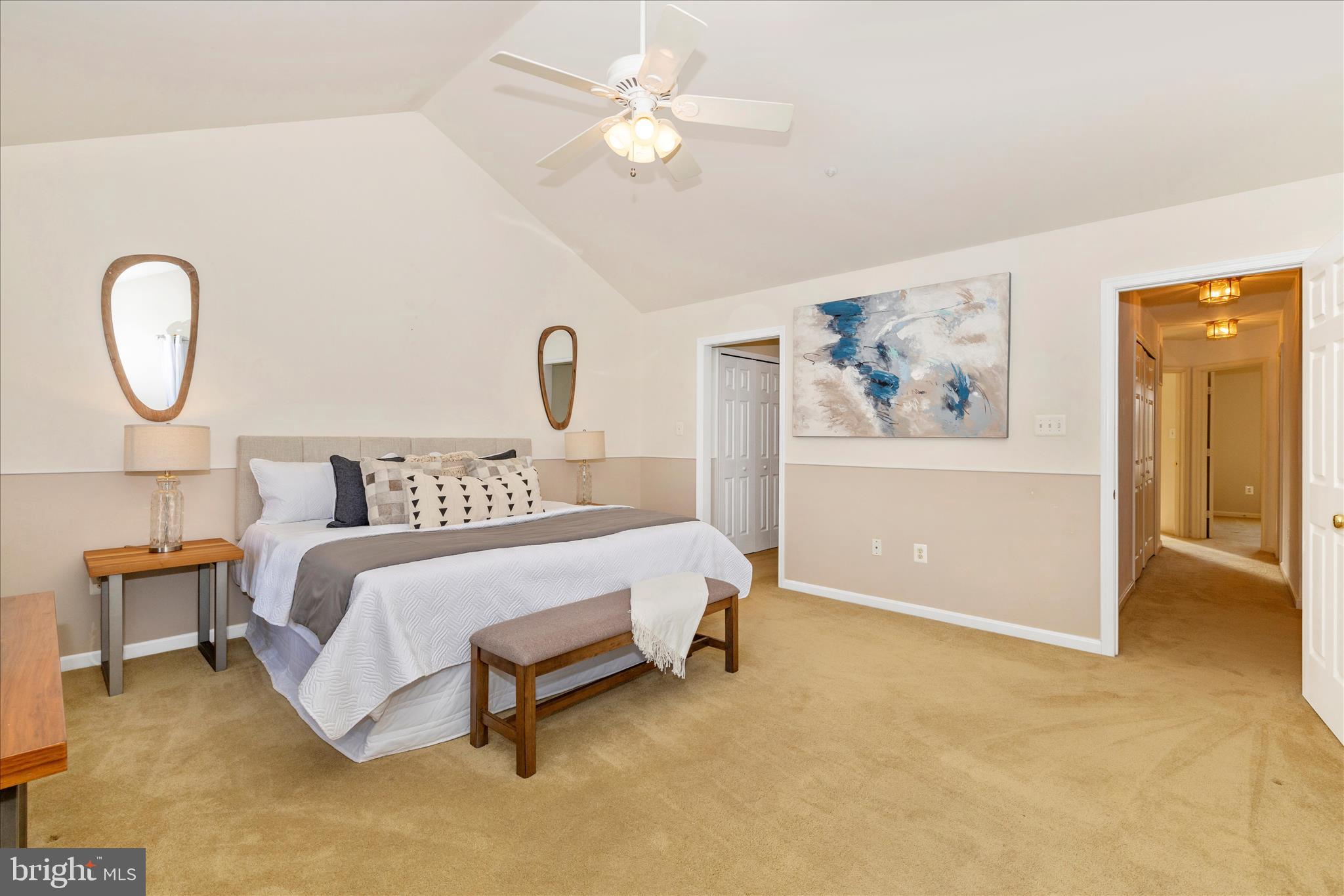 2409 Rippling Brook Road Frederick, MD 21701 - Photo 26 of 69 a spacious bedroom with a bed and a painting on the wall