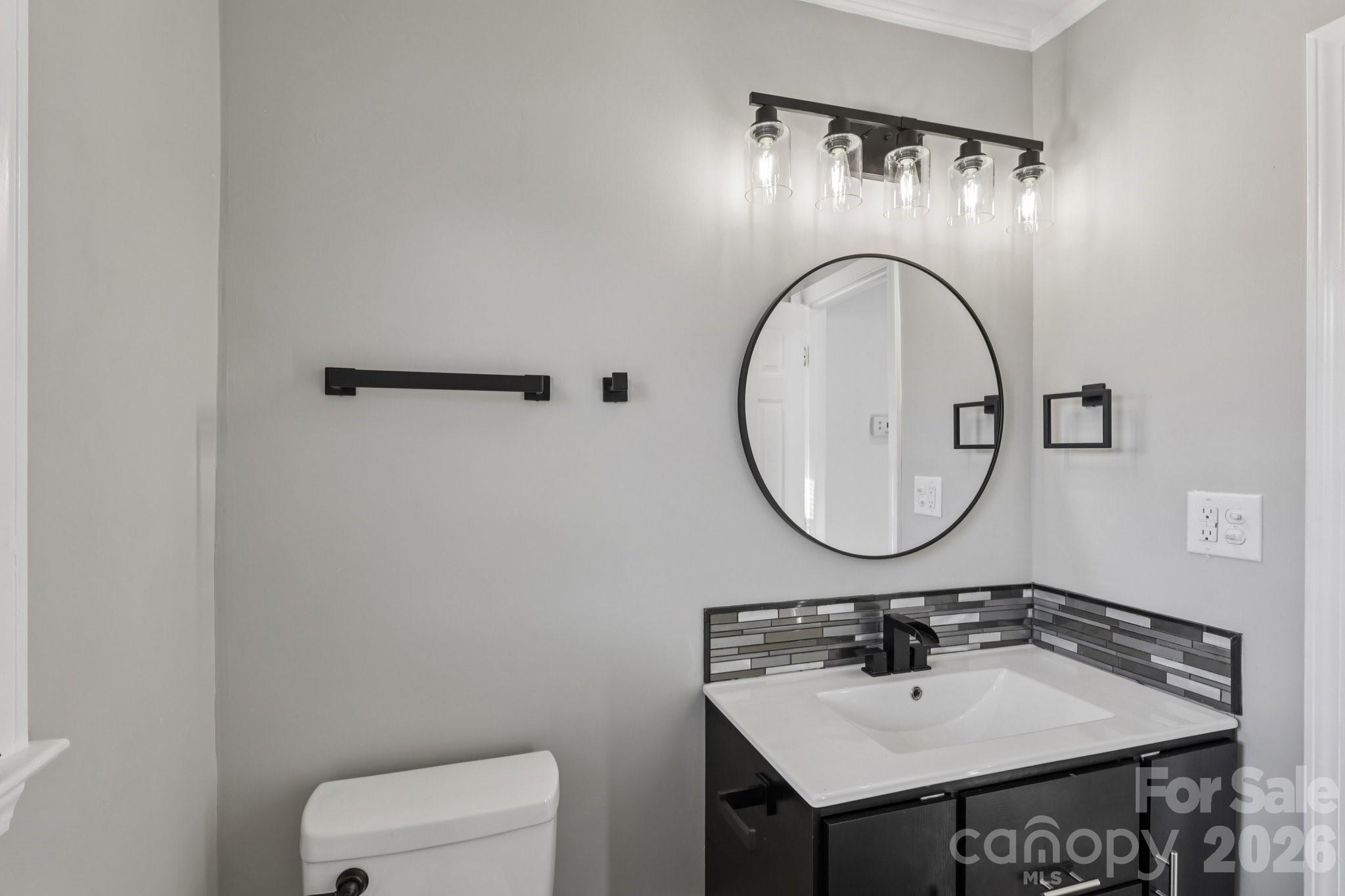 3207 Valley Dale Road Monroe, NC 28110 - Photo 23 of 30 a bathroom with a sink and a mirror
