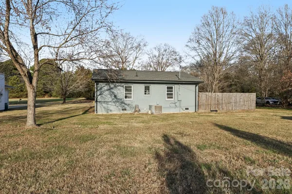 a view of back yard of house with green space