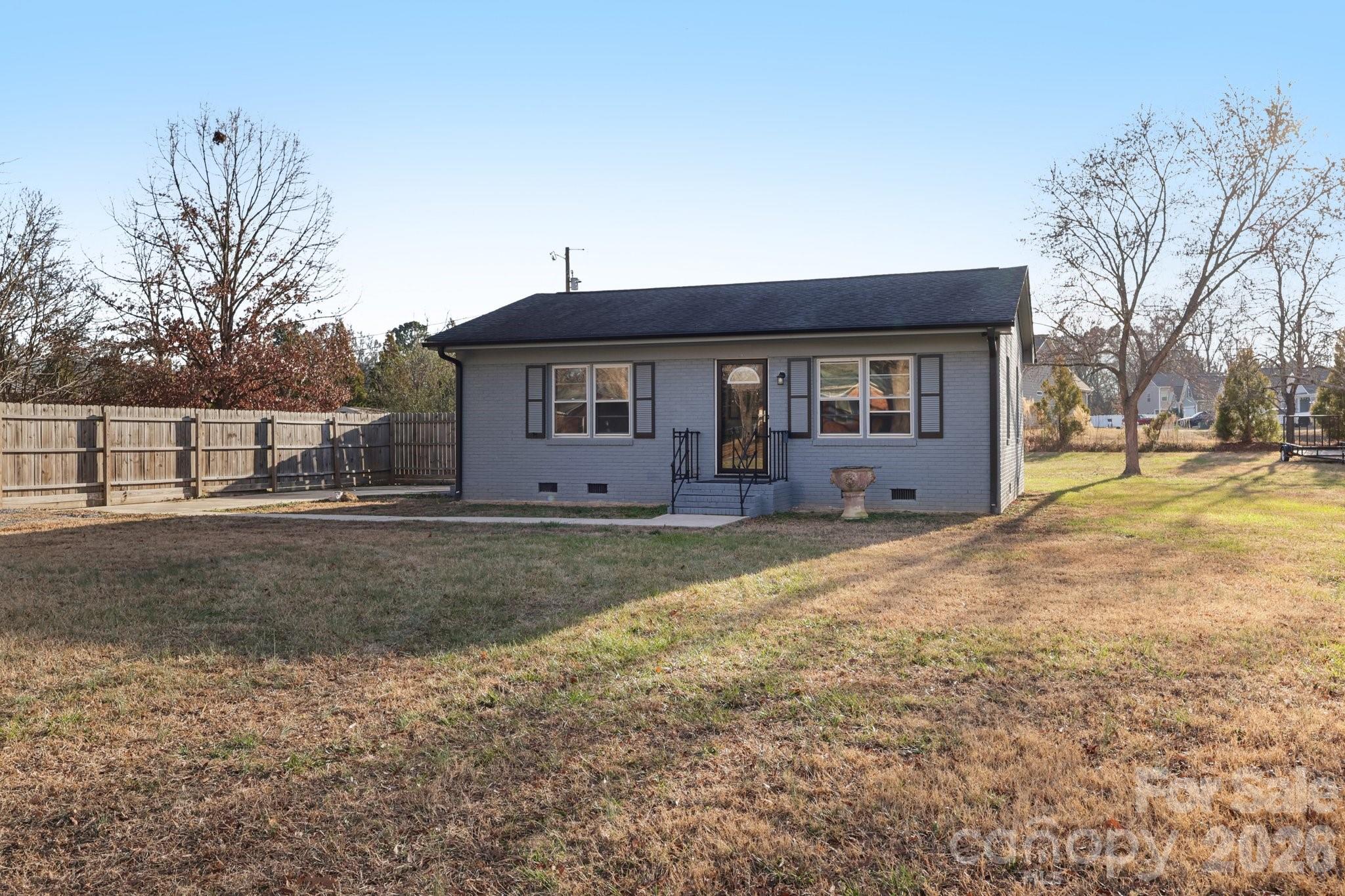 3207 Valley Dale Road Monroe, NC 28110 - Photo 3 of 30 a view of a house with backyard and trees