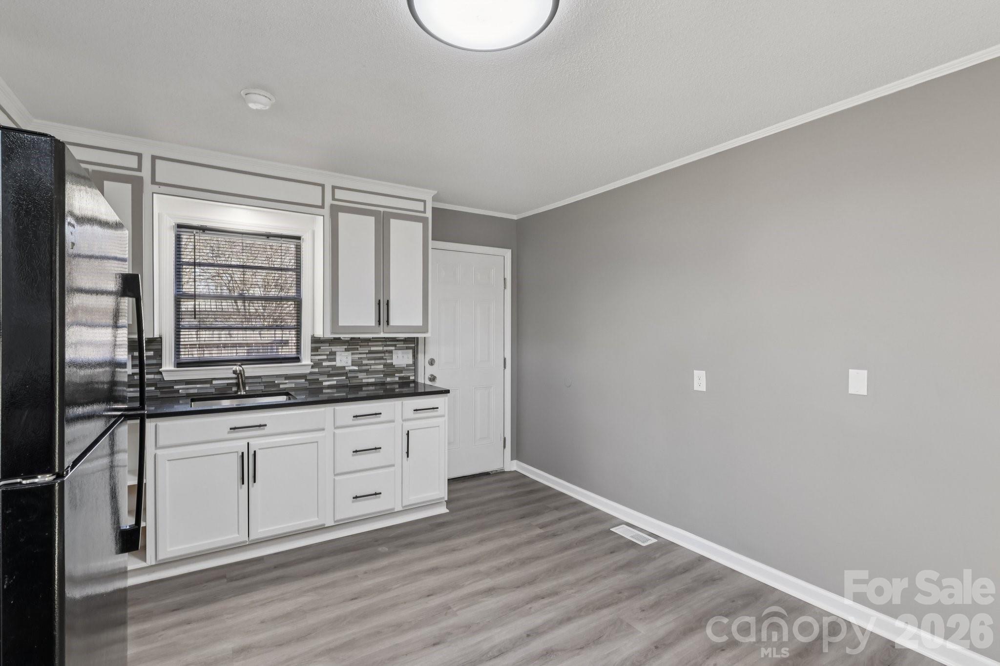 3207 Valley Dale Road Monroe, NC 28110 - Photo 10 of 30 a bathroom with a granite countertop sink and a mirror