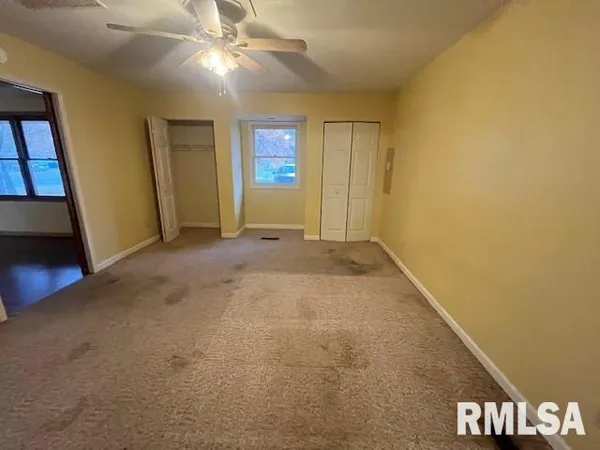 a view of an empty room and window