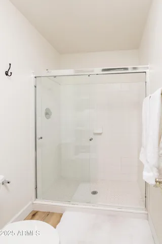 a bathroom with a shower and a bathtub