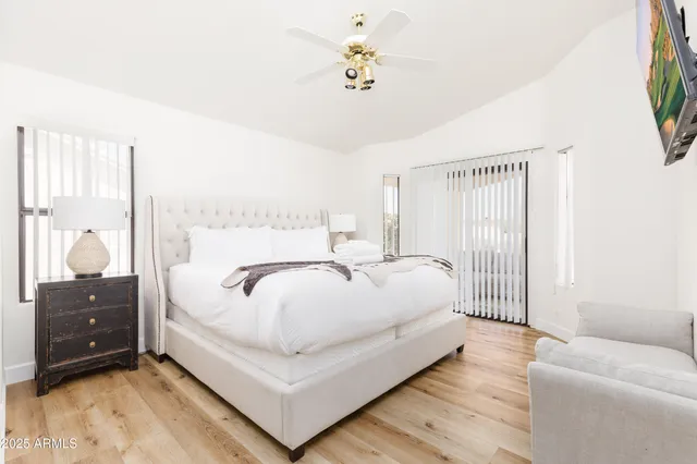 a bedroom with a bed and a dresser